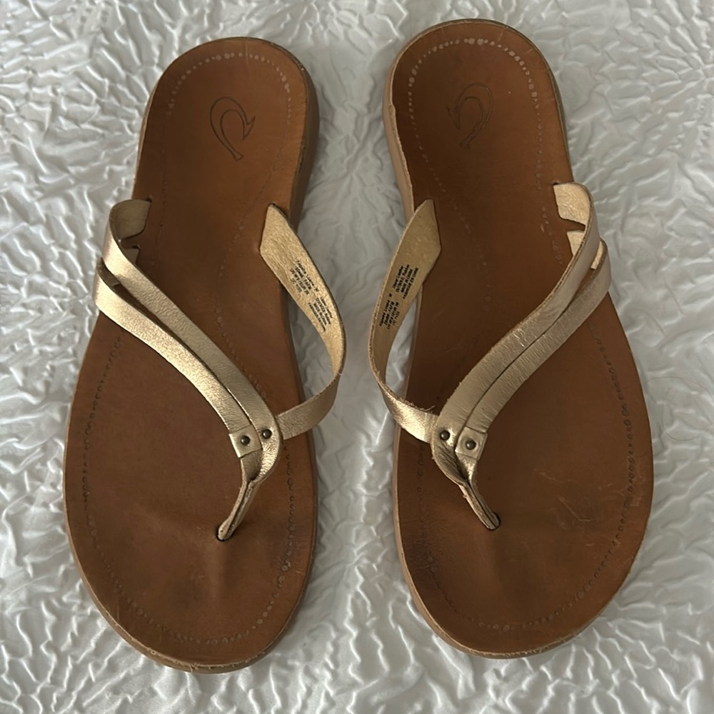 Olukai rose gold flip flops
